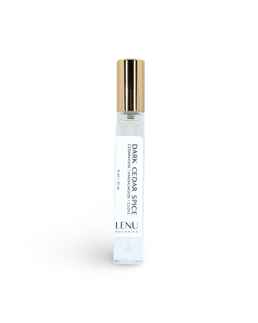 Lenu Botanics Dark Cedar Spice essential oil bottle on a white background